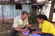 A surveyor working with a study participant. A surveyor working with a study participant.