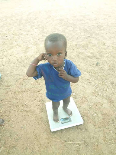 Child on a balance, Burkina Faso