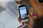 Photo of a person making a digital payment on a mobile phone.