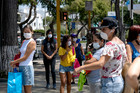 Shutterstock photo of people wearing face masks during the COVID-19 pandemic.