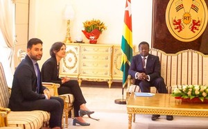 IPA's Executive Director Annie Duflo with IPA Francophone West Africa Country Director seated in a room with Togolese President Faure Gnassingbé