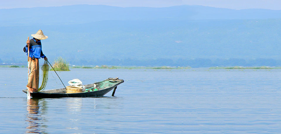 A fisherman on Inle Lake in Myanmar. Copyright IPA 2013 / Jaynie Whinnery. The individuals and locations depicted are not images of confirmed instances of human trafficking.
