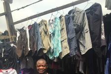 A used clothing trader and his stock in Lagos, Nigeria