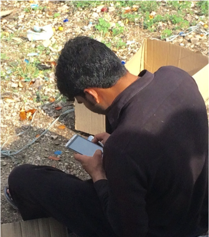 Mobile solutions to financial inclusion show promise A man in Pakistan uses a smartphone