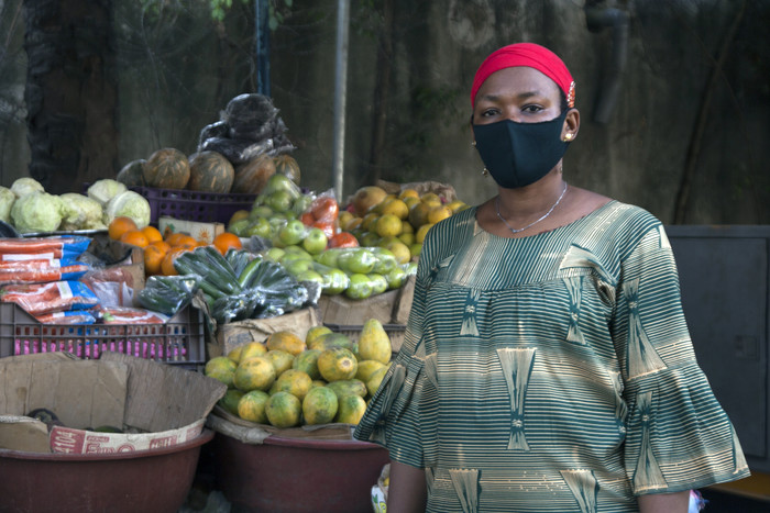 Vendor wearing mask in C'ote D'Ivoire Vendor wearing mask in C'ote D'Ivoire